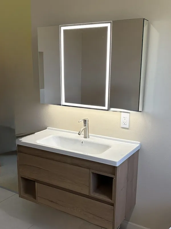 Bathroom vanity with a lighted LED mirror cabinet